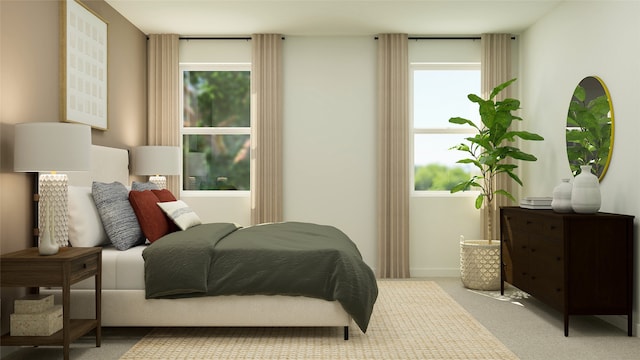 bedroom featuring carpet floors and baseboards