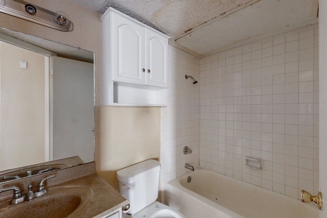 bathroom with toilet, tub / shower combination, vanity, and a textured ceiling