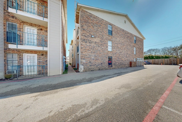 view of property exterior with brick siding