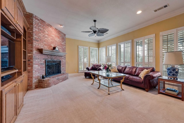 living area featuring plenty of natural light, carpet flooring, visible vents, and crown molding