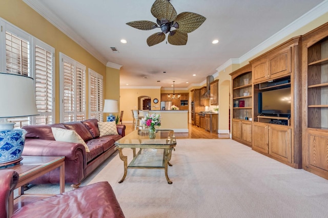 living room with recessed lighting, ceiling fan with notable chandelier, light colored carpet, visible vents, and crown molding