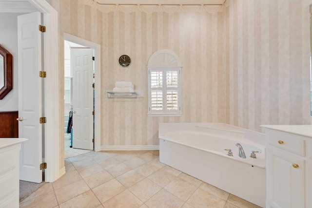 full bathroom with baseboards, tile patterned floors, a garden tub, and wallpapered walls