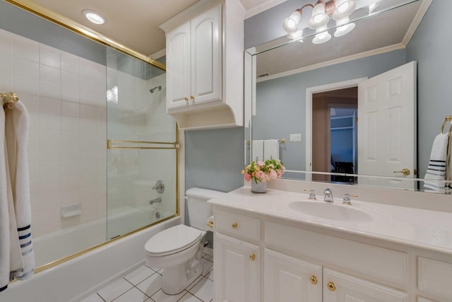 bathroom with crown molding, toilet, enclosed tub / shower combo, vanity, and tile patterned floors