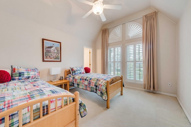 bedroom featuring lofted ceiling, baseboards, ceiling fan, and carpet