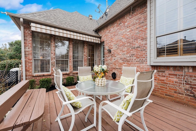 deck with outdoor dining area