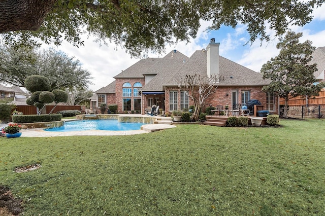 view of swimming pool featuring a yard, a fenced backyard, and a fenced in pool