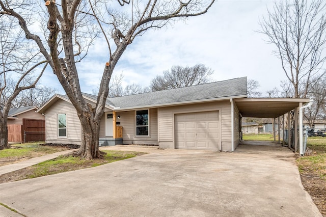 view of front of home featuring concrete driveway, roof with shingles, an attached garage, and fence