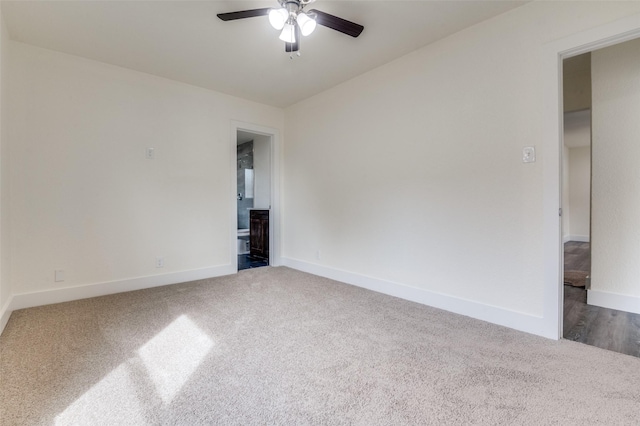 empty room featuring carpet flooring, ceiling fan, and baseboards