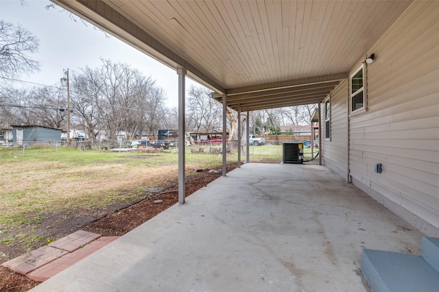 view of patio / terrace featuring fence and central AC unit