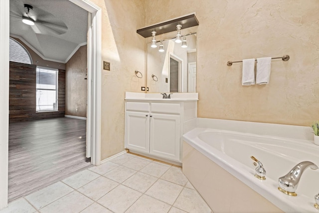 full bathroom featuring lofted ceiling, tile patterned flooring, a textured ceiling, and a textured wall