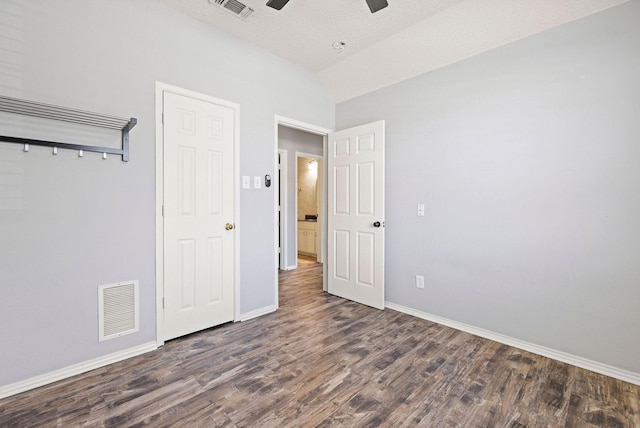 unfurnished bedroom with baseboards, visible vents, and wood finished floors