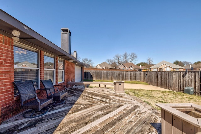 deck with a fenced backyard