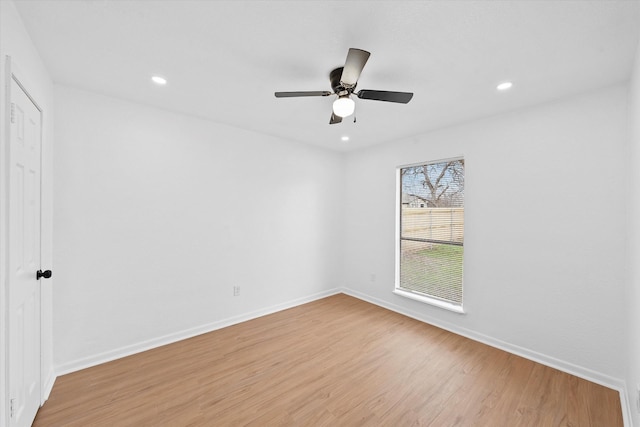 unfurnished room featuring light wood finished floors, recessed lighting, a ceiling fan, and baseboards