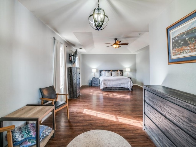 bedroom featuring dark wood-style floors, baseboards, and a chandelier