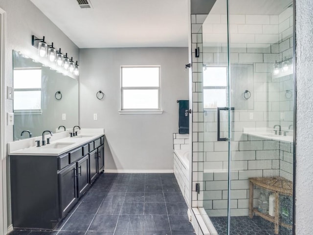 full bath featuring a sink, a shower stall, baseboards, and a bath