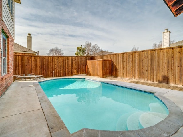 view of swimming pool with a patio, a fenced backyard, and a fenced in pool