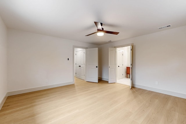 unfurnished bedroom with ceiling fan, light wood-type flooring, visible vents, and baseboards