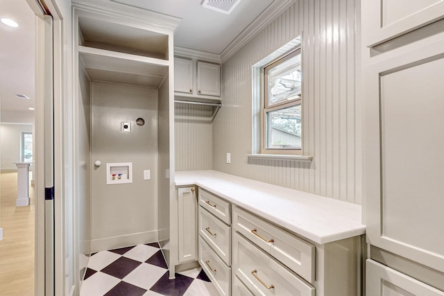 laundry room with laundry area, baseboards, visible vents, hookup for a washing machine, and light floors