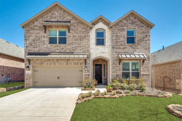 1612 Olympia Ave, Corinth, TX 76208 - french country style house featuring a front lawn, driveway, a standing seam roof, a garage, and brick siding