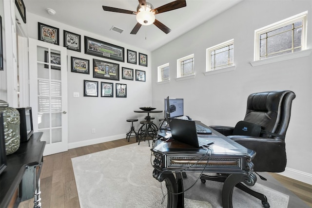 1612 Olympia Ave, Corinth, TX 76208 - office featuring visible vents, baseboards, a ceiling fan, and wood finished floors