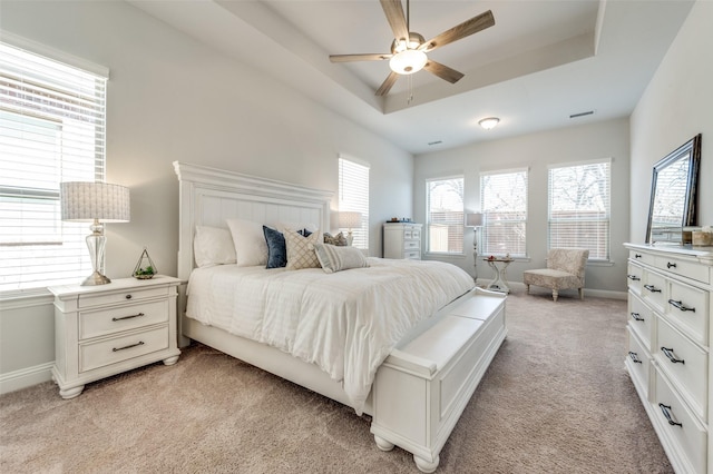 1612 Olympia Ave, Corinth, TX 76208 - bedroom with a raised ceiling, a ceiling fan, baseboards, and light carpet
