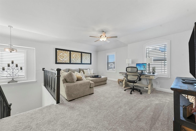 carpeted home office featuring a ceiling fan and baseboards