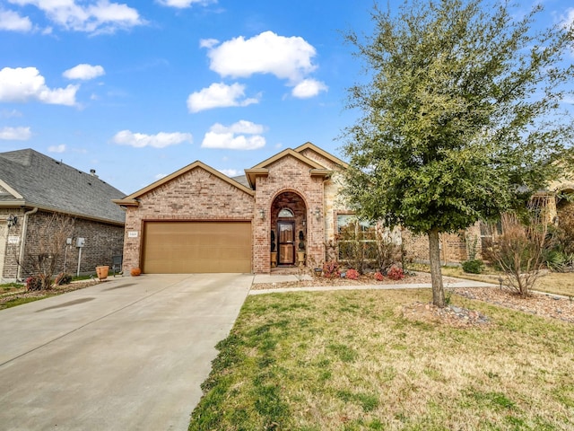 view of front facade with driveway, brick siding, a front lawn, and an attached garage