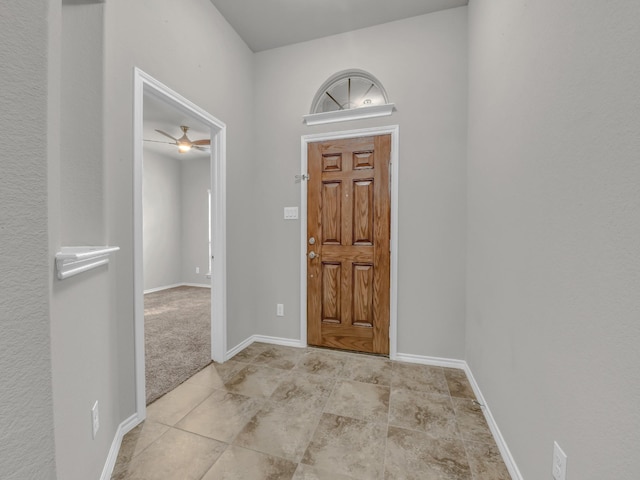 tiled entrance foyer with baseboards