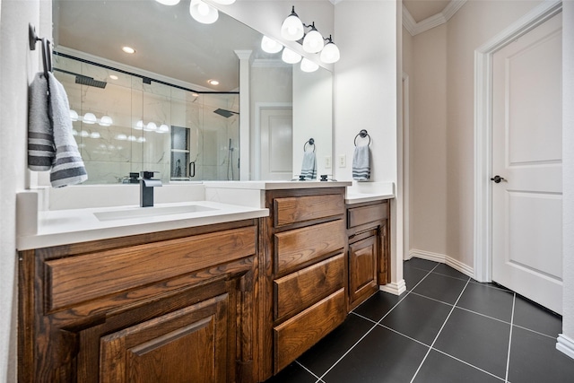 full bathroom featuring a stall shower, baseboards, tile patterned floors, crown molding, and vanity