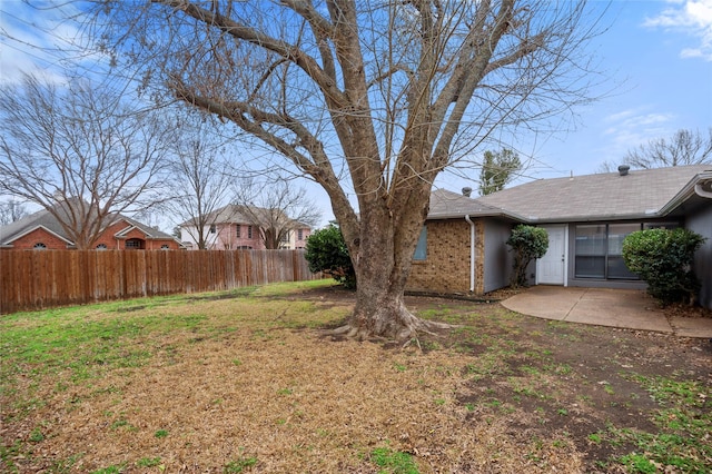 view of yard featuring a patio area and fence