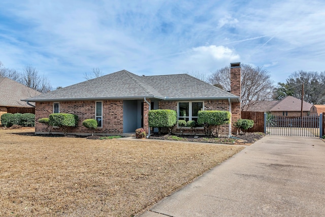 ranch-style house with a shingled roof, a chimney, fence, and a gate