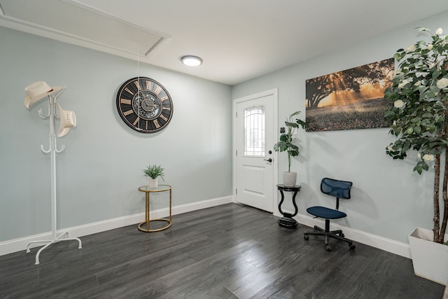 foyer entrance featuring dark wood-style floors and baseboards