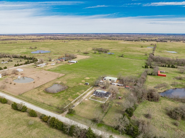 birds eye view of property with a rural view