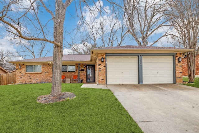 ranch-style house with a garage, concrete driveway, brick siding, and a front lawn