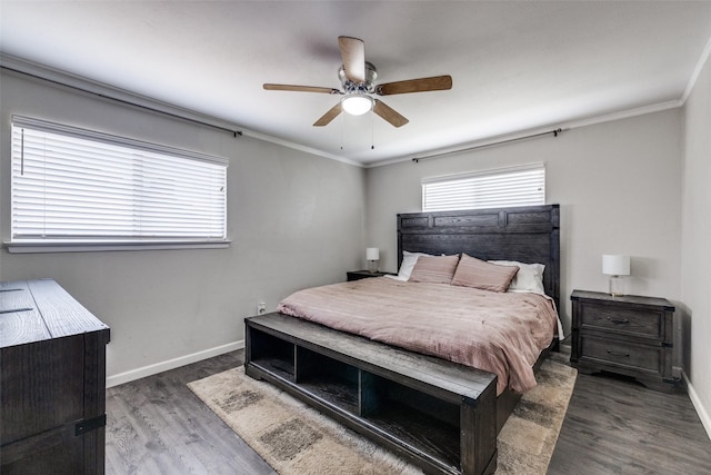 bedroom featuring crown molding, wood finished floors, a ceiling fan, and baseboards