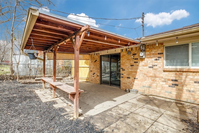 view of patio featuring fence