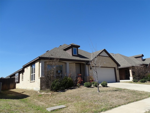 view of front of home featuring brick siding, roof with shingles, concrete driveway, an attached garage, and a front yard