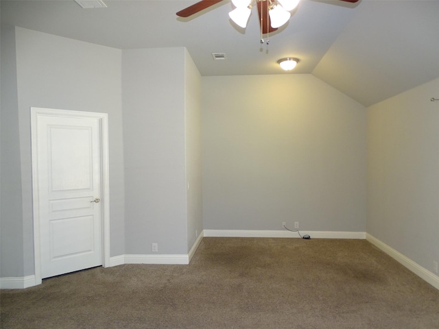 bonus room with baseboards, vaulted ceiling, and carpet flooring