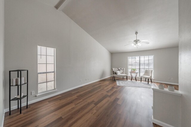 unfurnished room featuring ceiling fan, baseboards, high vaulted ceiling, and dark wood finished floors