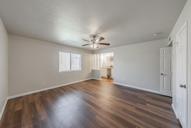 unfurnished bedroom featuring ceiling fan, visible vents, baseboards, and dark wood-style floors