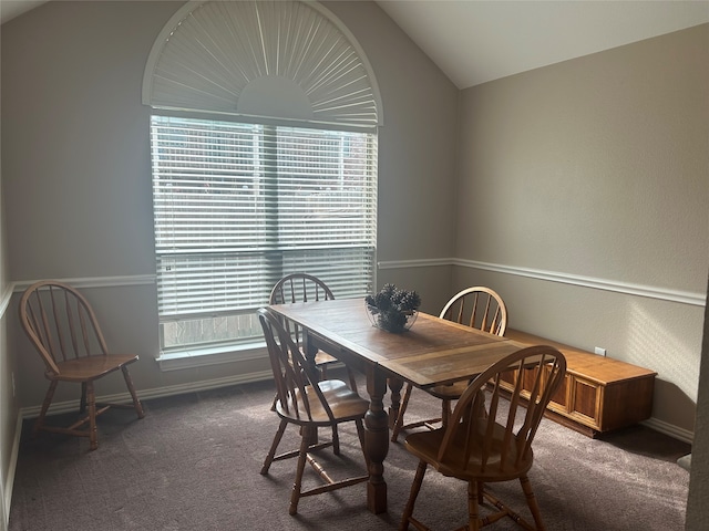 dining room featuring vaulted ceiling, baseboards, and carpet floors