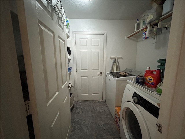 washroom with washer and dryer and laundry area