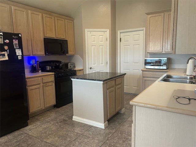 kitchen with a center island, black appliances, and a sink