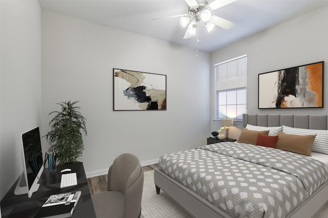 bedroom featuring ceiling fan, baseboards, and wood finished floors