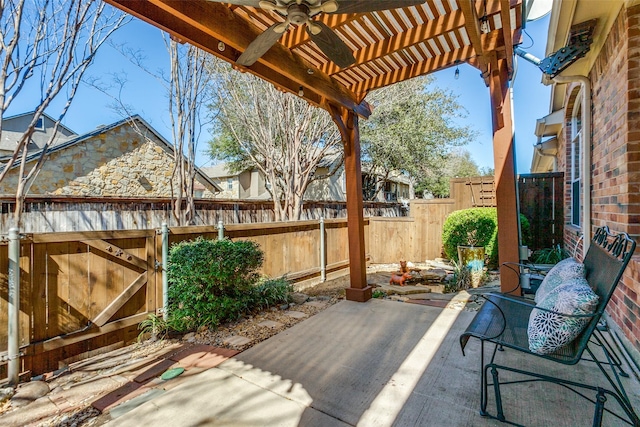 view of patio with a ceiling fan, a fenced backyard, and a pergola