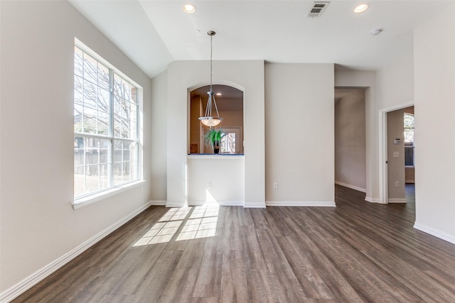 unfurnished dining area with visible vents, baseboards, lofted ceiling, recessed lighting, and wood finished floors