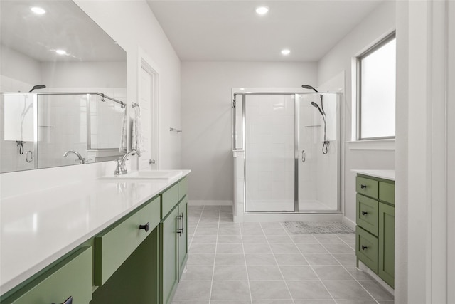 bathroom featuring recessed lighting, a shower stall, vanity, and tile patterned floors