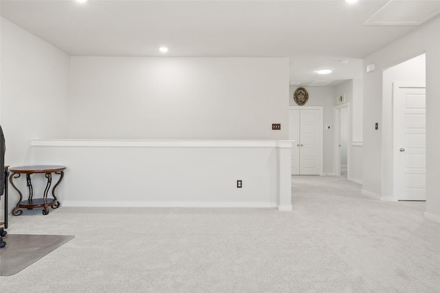 carpeted empty room with baseboards and recessed lighting