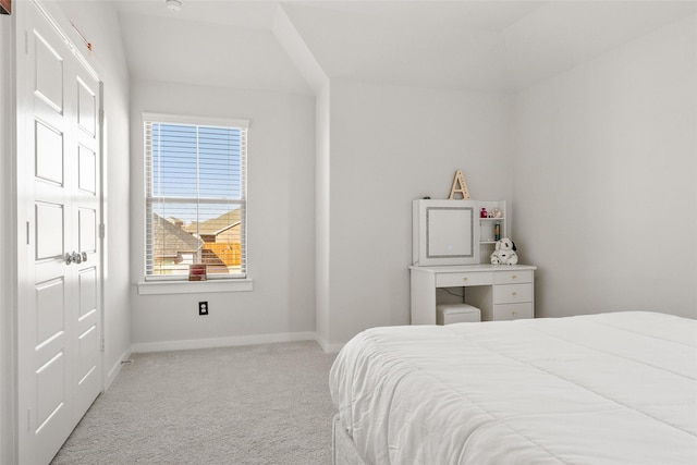 bedroom with carpet floors and baseboards