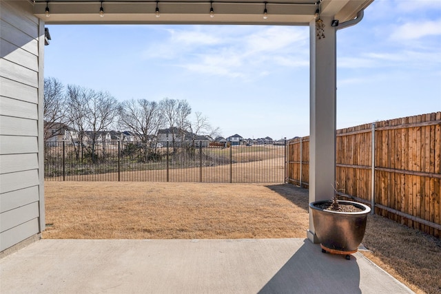 view of yard featuring a fenced backyard and a patio